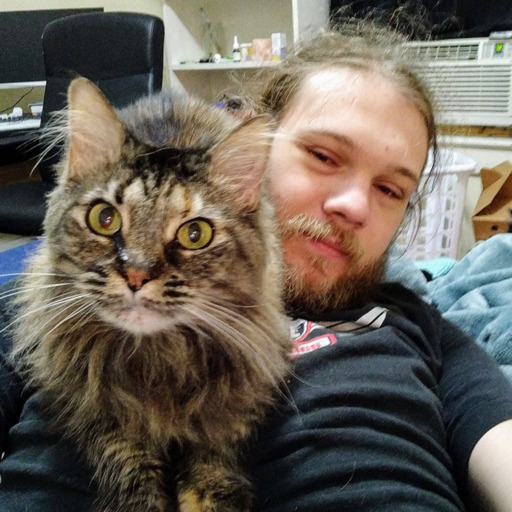 A picture of the author with a cat